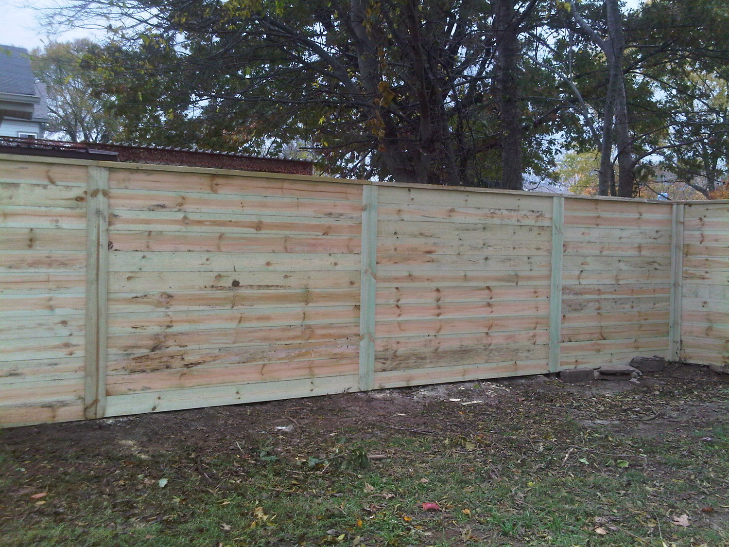 Rough Cut Horizontal Privacy Fence, Heart Pine Floors